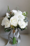 White Hand Holding Artificial Bridal Bouquet