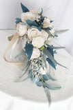 Hand Holding White and Blue Bridal Bouquet