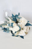 Hand Holding White and Blue Bridal Bouquet